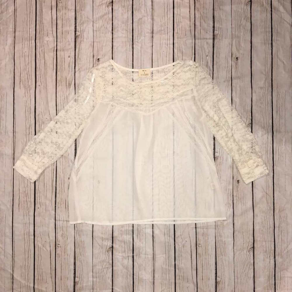 Sheer white lace blouse.